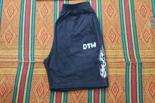 Gray DTW shorts displayed on a colorful woven mat, perfect for daily errands and weekend adventures.