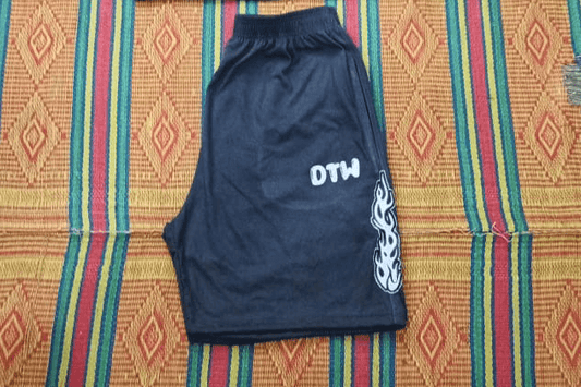 Gray DTW shorts displayed on a colorful woven mat, perfect for daily errands and weekend adventures.