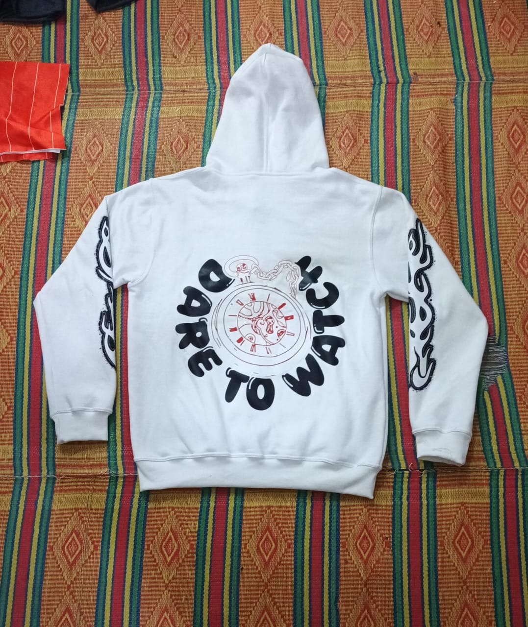 Hoodies design featuring striking back graphics and slogan, perfect for streetwear style and comfort.