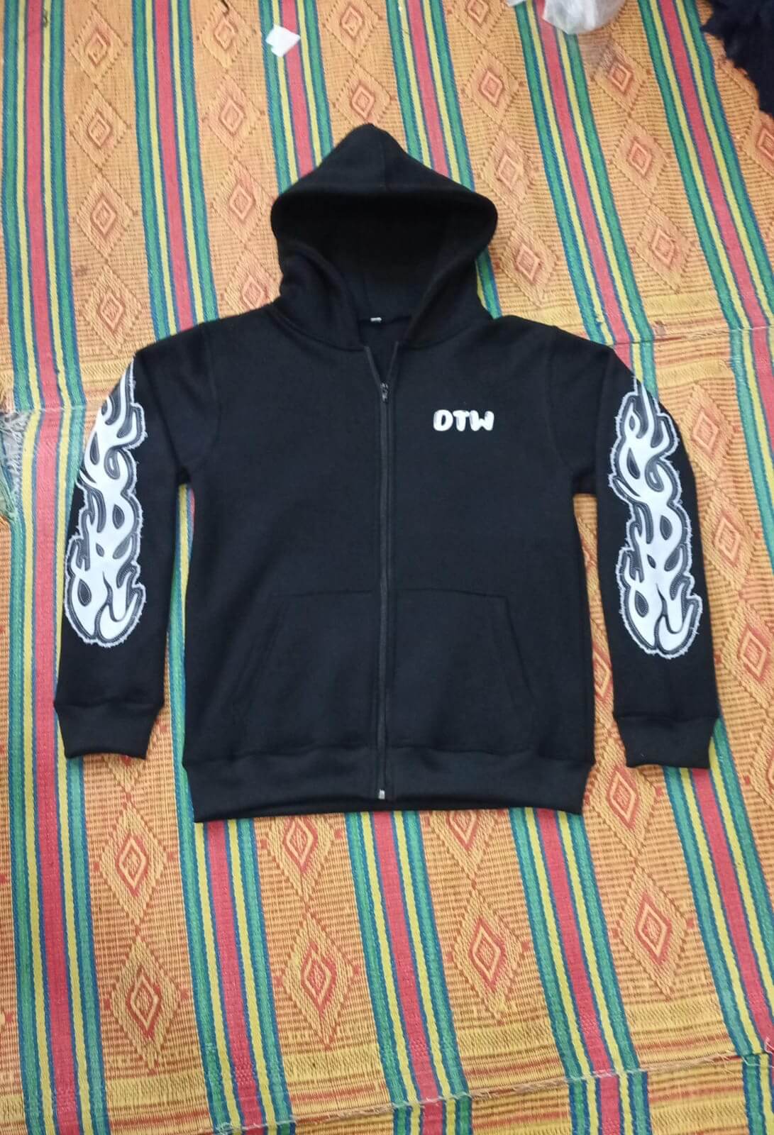 Black DTW hoodies featuring flame graphics, perfect for stylish comfort and versatile wear.