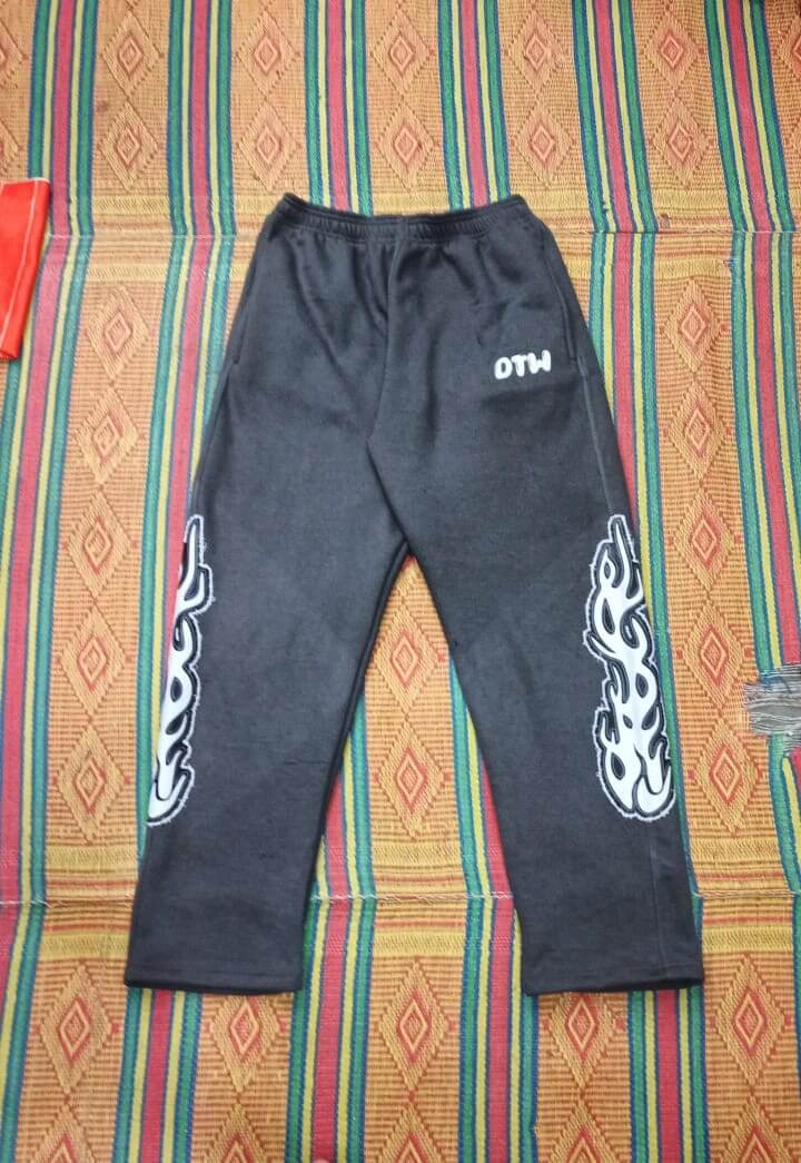 Gray DTW pants featuring stylish flame designs, breathable fabric for comfort and versatility.